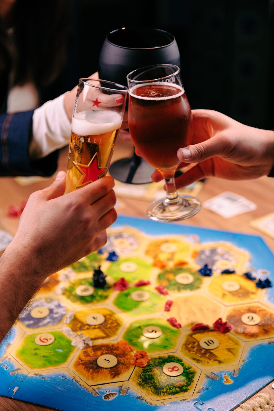 Cheers over a game of Catan at RABOTEKA
