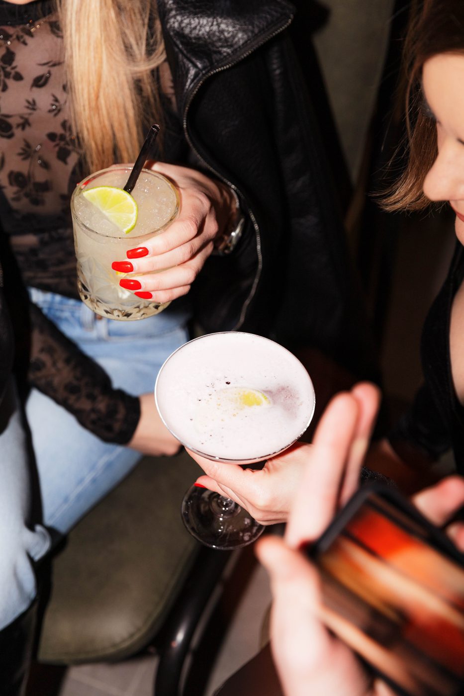 Hands holding cocktails at RABOTEKA