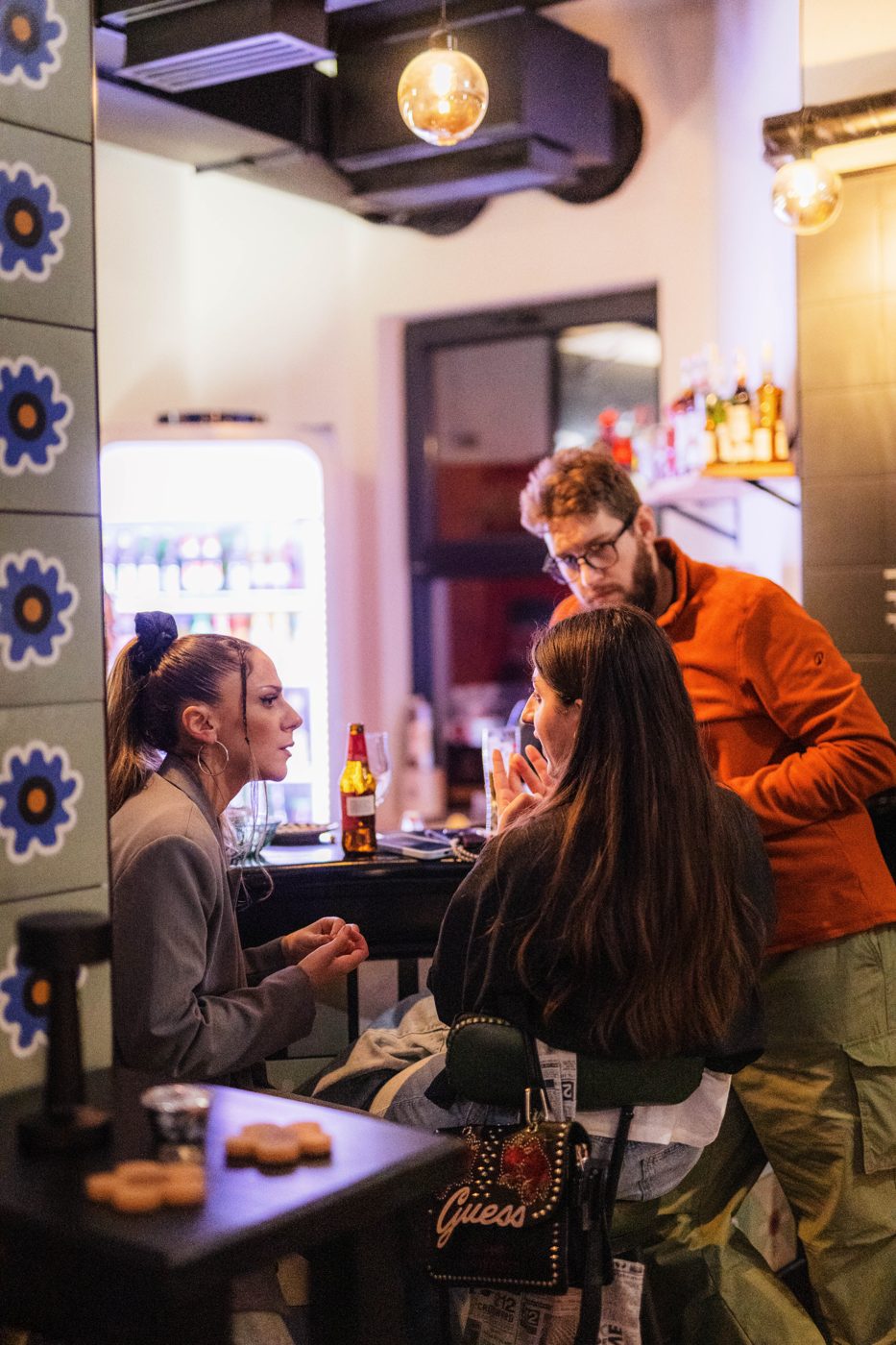 Friends in conversation at the bar at RABOTEKA