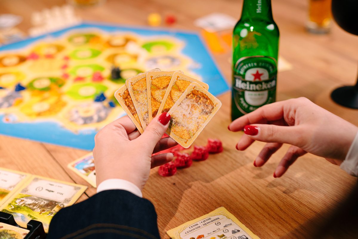 Playing Catan with a drink at RABOTEKA